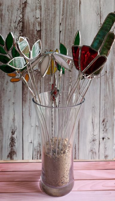 a vase of stained glass flowers